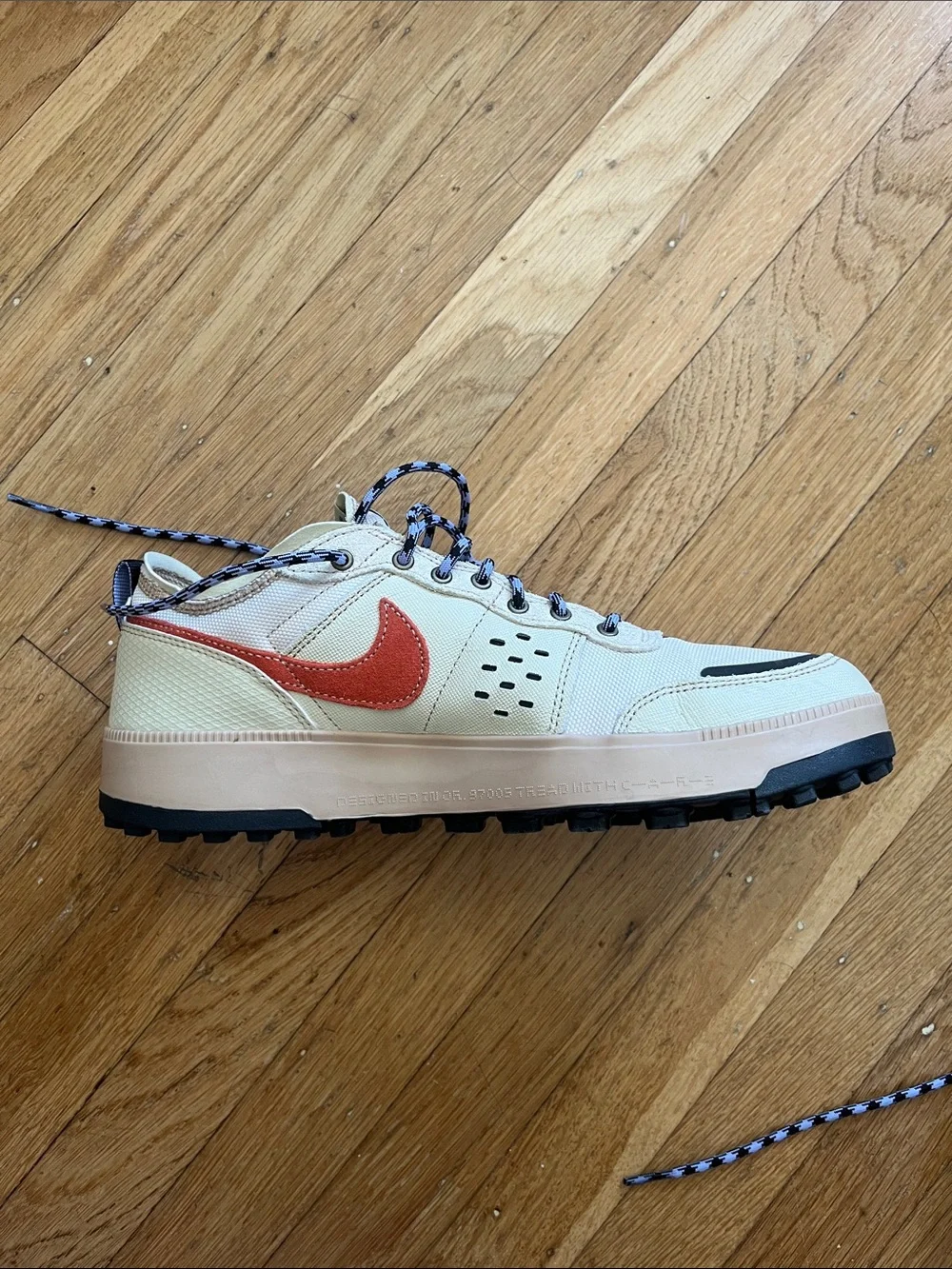 Nike Men's Cream Sneakers with Orange Swoosh and Black Accents